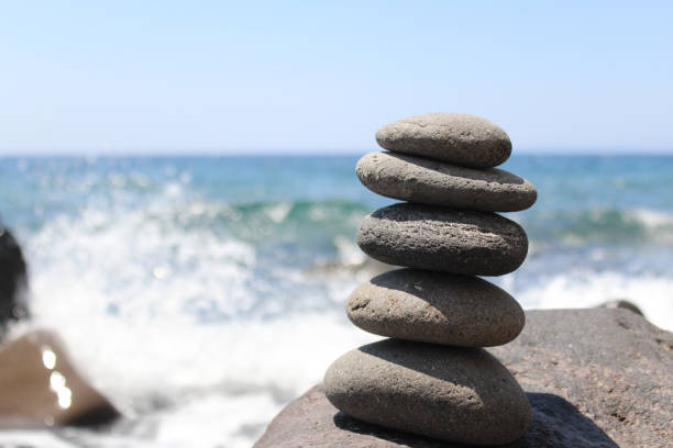 istock Smooth Stones Stacked on Greek Island Beach 828992794