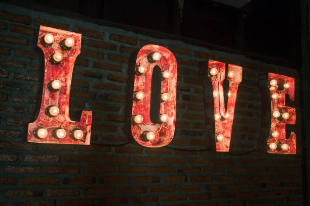 istock LOVE bulb sign decorated on brick wall 829005316