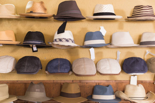 istock Color sun hats hanging on the shelf 829006626