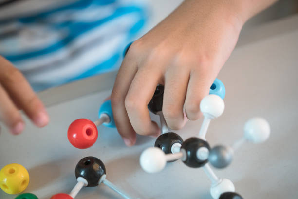 istock one asian boy playing ball and stick structure in the classroom 829030306