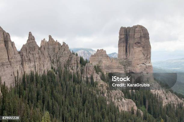 Chimney Rock With Jagged Mountain Range In The Uncompahgre National Forest Stock Photo - Download Image Now