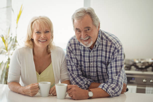 istock Senior couple holding coffee cup 829073762