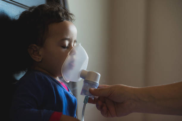istock Little girl makes inhalation at home 829092656