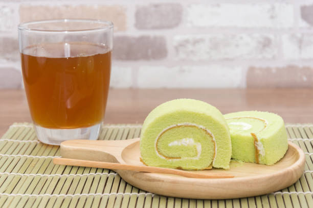 istock slice of pandan roll cake and jasmine tea 829112950