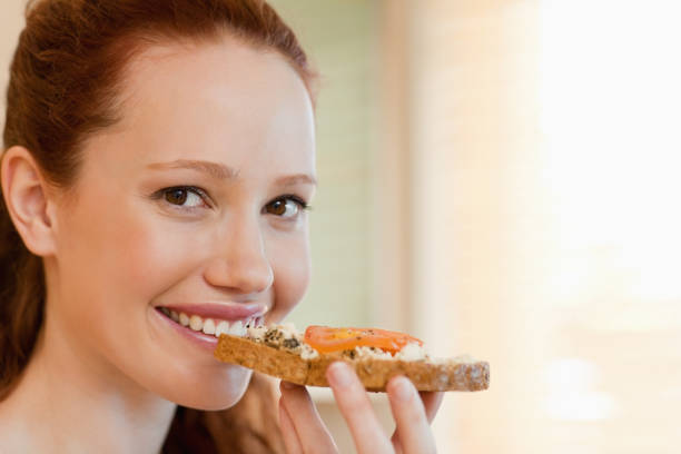 istock Cheerful woman with slice of bread 829118950