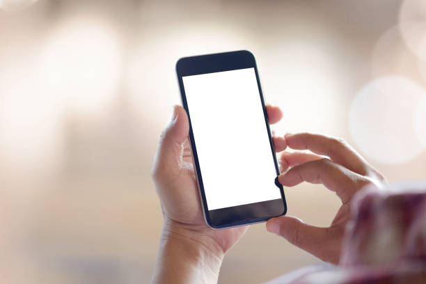 istock Mock up Smartphone : Business man hands holding mobile phone with abstract bokeh background. 829120820