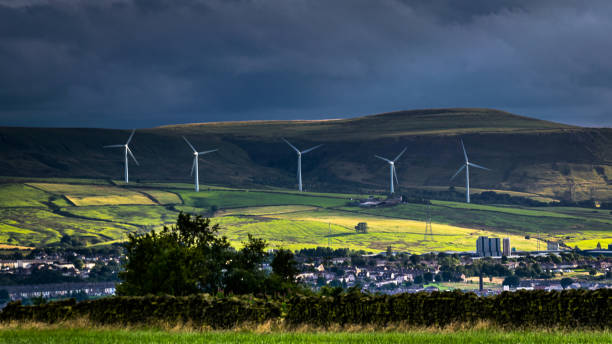 istock Wind turbines and clouds over a farms and hills 829143764