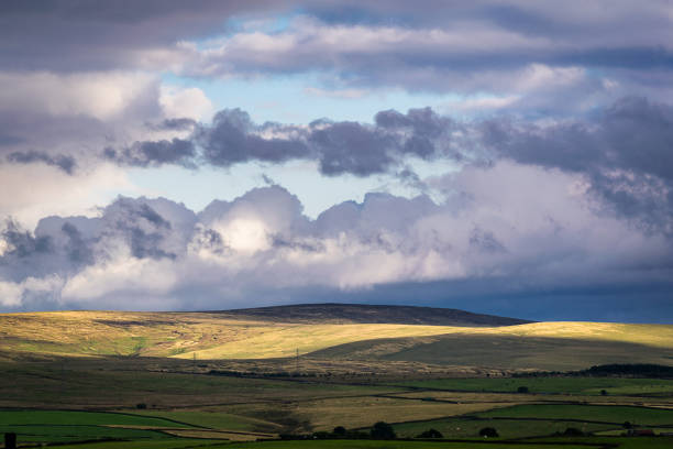 istock Clouds over a farms and hills in Lancashire 829143848
