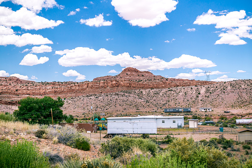 Bitter Springs, Arizona, USA - June 20, 2017: Trailer town of the Navajo in the desert of Arizona. Village life in the Navajo reservation. Movable Navajo houses and cattle ranch. Car trip in Arizona, USA