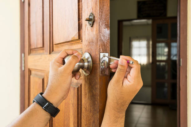 istock locksmith install the silver knob on old wood door by screwdriver 829157536