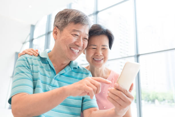 istock old couple use phone 829160180