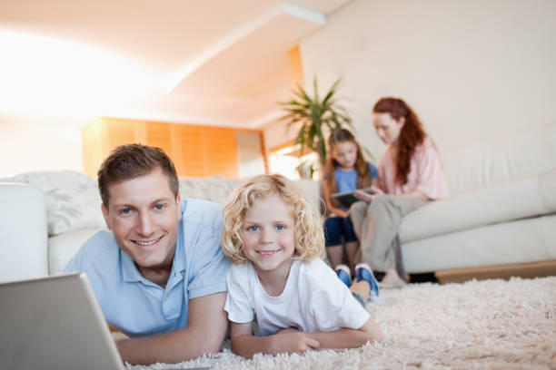 istock Father and son using the internet in the living room 829164494