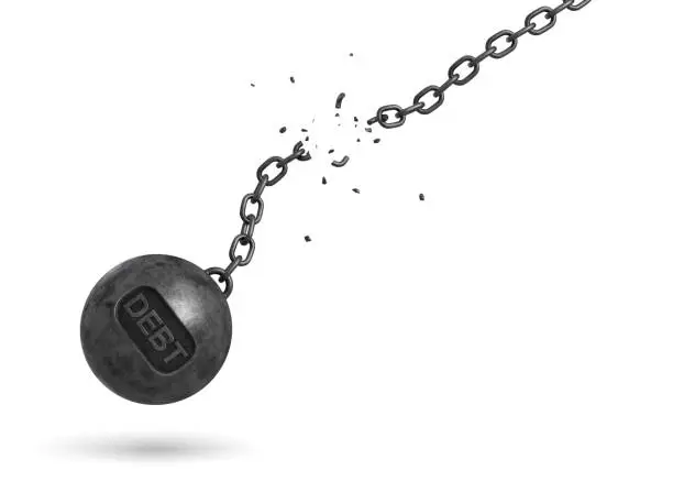 Photo of 3d rendering of a black iron wrecking ball with a writing DEBT on it swings on a broken chain