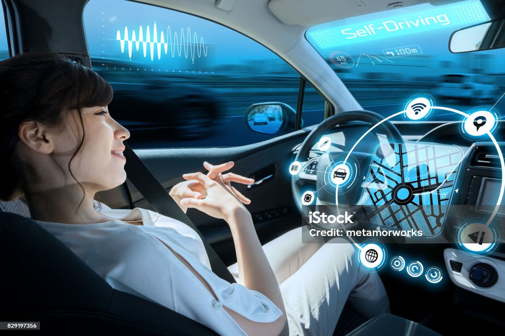 relaxed woman in autonomous car. self driving vehicle. autopilot. automotive technology. Autonomous Technology Stock Photo