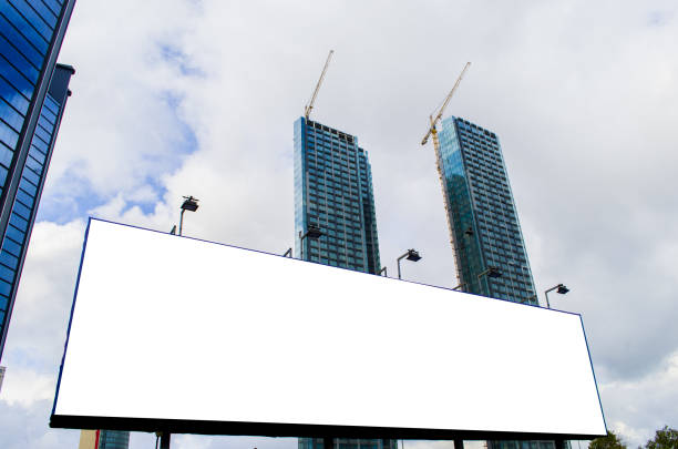istock Blank billboard at skyscrapers backgound, mock up 829197400