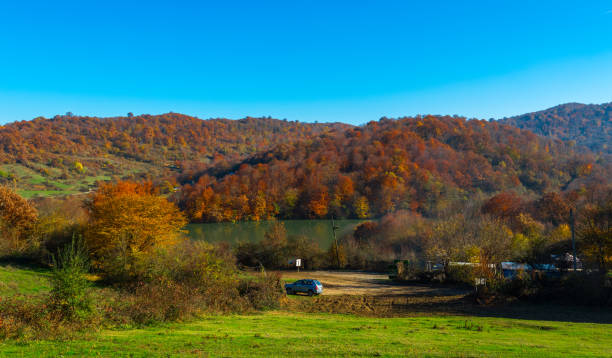 istock High mountain lake in autumn colors 829198032