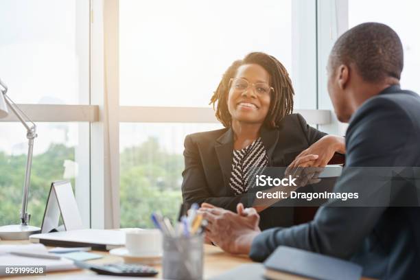 Chatting With Colleague Stock Photo - Download Image Now - African-American Ethnicity, Coworker, Males