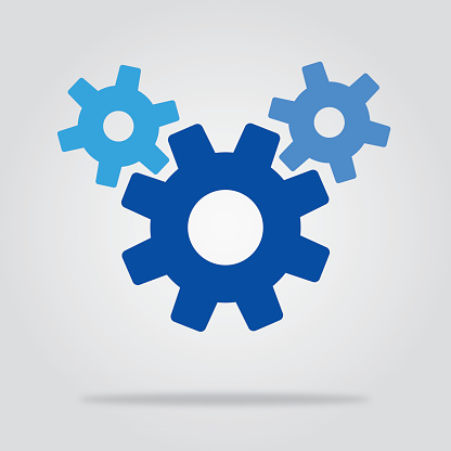 Vector illustration of three blue gears with a shadow underneath them on a gradient gray background.