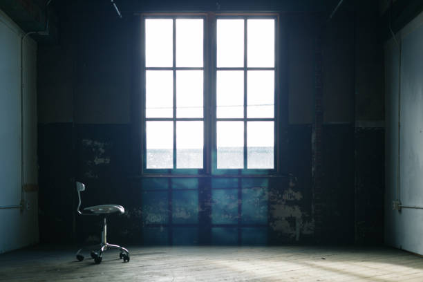 istock Lone chair in an emply old room 829205104