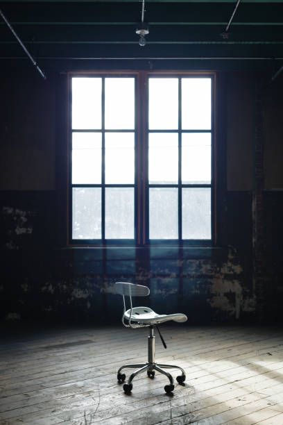istock Lone chair in an empty old room 829205146