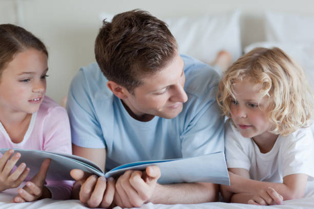 istock Father reading with his children 829210920