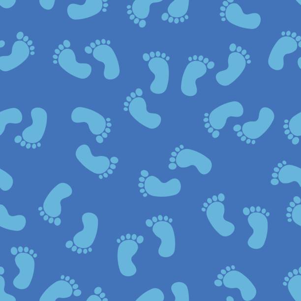 istock Seamless pattern with baby footprint. Traces of children on a blue background. For a boy 829225032