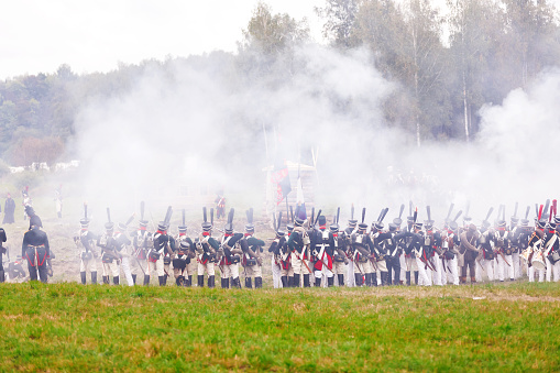 BORODINO, RUSSIA - September 06, 2015 - Reenactment of the battle of Borodino (the Patriotic war of 1812 year). Tourists watch the performance from from the fenced places. Moscow region, Russia.