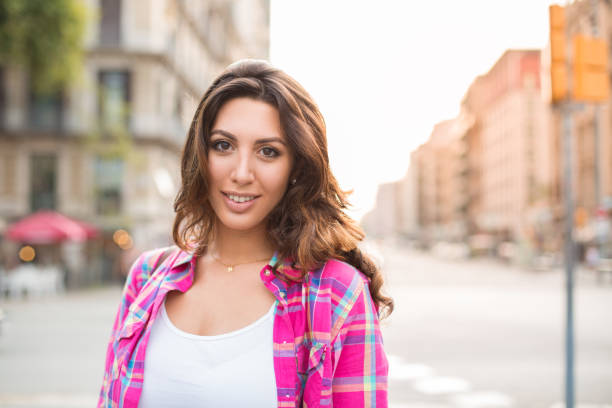 istock Smiling young woman having summer stroll 829250580