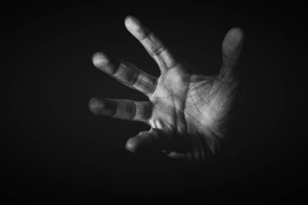istock Human hand from abstract pose in studio tone into black and white 829251732