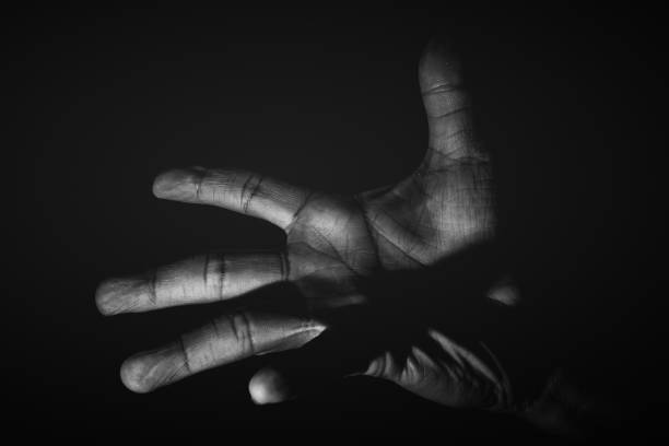 istock Human hand from abstract pose in studio tone into black and white 829251764