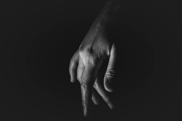istock Human hand from abstract pose in studio tone into black and white 829251890