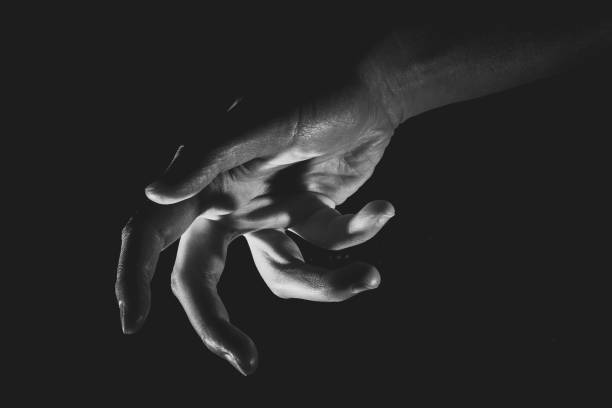 istock Human hand from abstract pose in studio tone into black and white 829251940