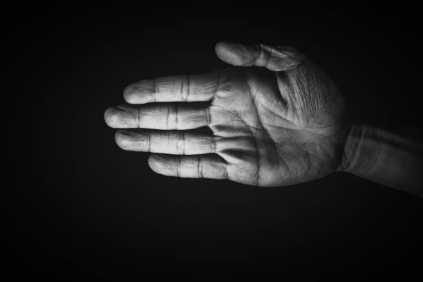 istock Human hand from abstract pose in studio tone into black and white 829251970