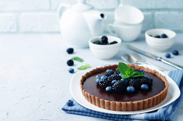 istock Chocolate tart with blackberries and blueberries 829252040
