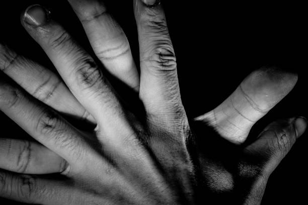 istock Human hand from abstract pose in studio tone into black and white 829252294