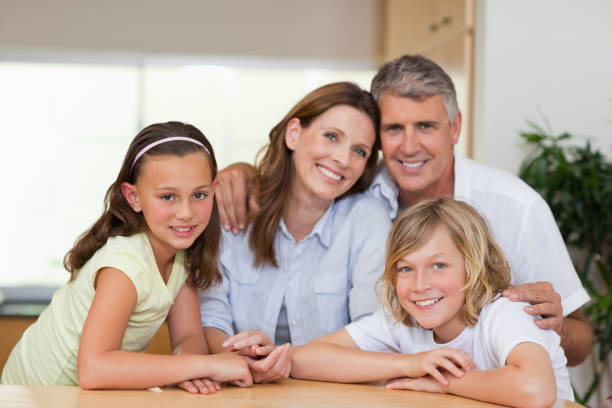 istock Family together behind table 829279950