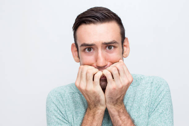 istock Closeup of Nervous Young Man Freaking Out 829280554
