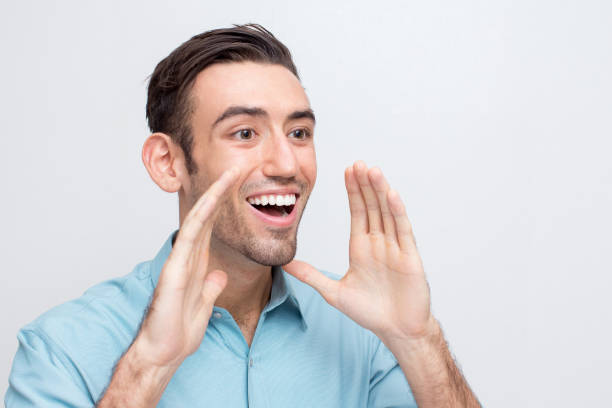 istock Joyful Young Handsome Man Going to Shout Loud 829280808