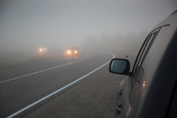 istock Cars driving in thick fog 829285408