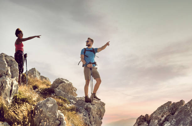 istock Young Couple on Top of Mountain 829288188