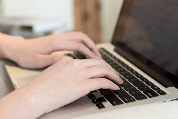 istock hands touch keyboard of laptop 829302822