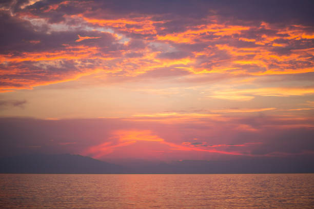 istock Golden sunrise sunset over the sea ocean waves 829302876