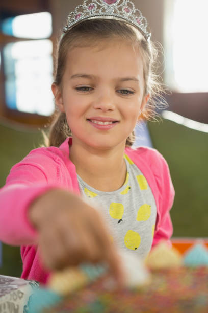 istock Birthday girl eating cake 829314226