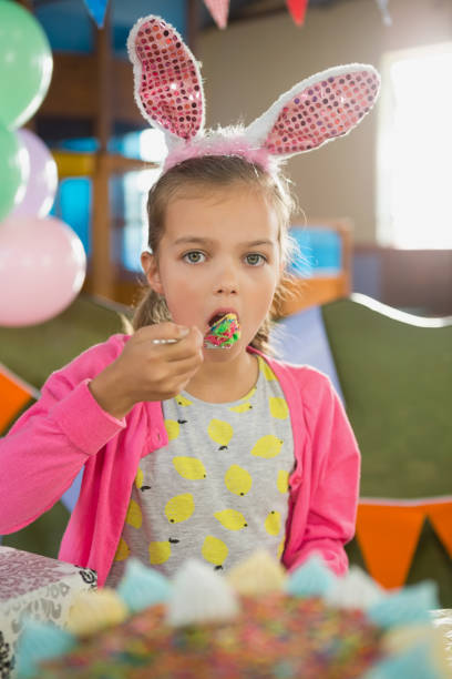 istock Birthday girl eating a cake 829315912