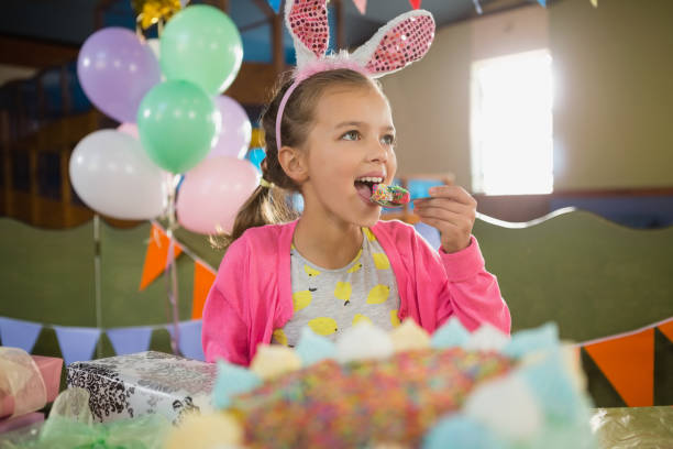 istock Birthday girl eating a cake 829316064