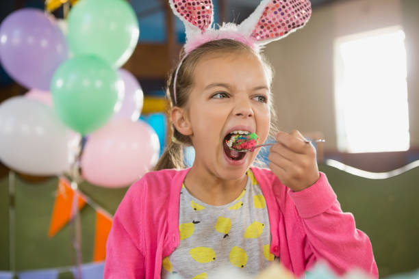 istock Birthday girl eating a cake 829316332