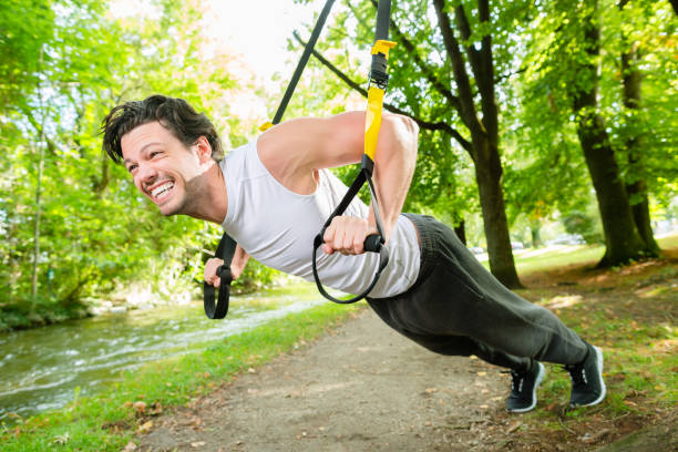 istock man doing suspension trainer sling sport 829325072