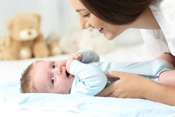 istock Mother and baby on a bed 829345974