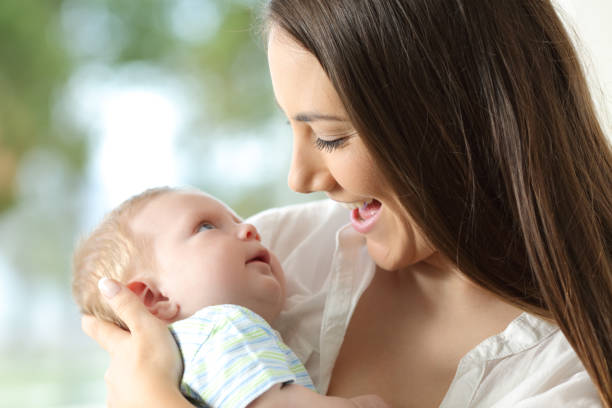 istock Proud mother holding her baby 829350680