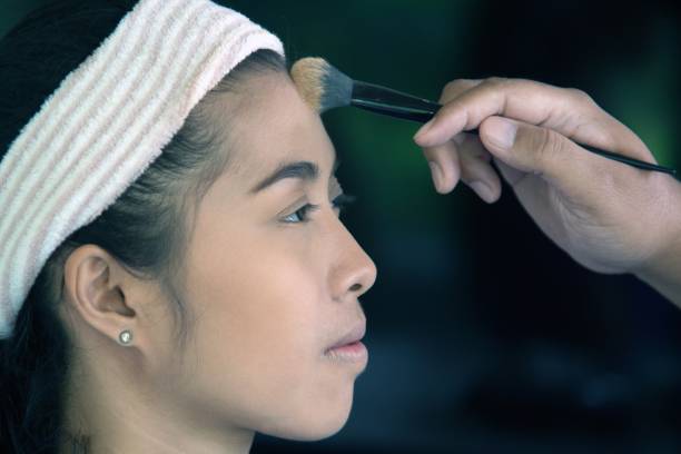 istock Professional make up applying by artist. 829353304